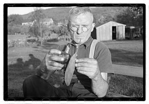 A man holding mechanical components