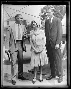 Charles and Anne Lindbergh speaking with another person