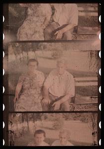Two people seated on a bench