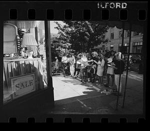 Design class observes store display, Newbury Street, downtown Boston