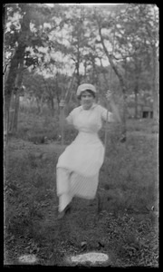 Girl on swing in mop cap