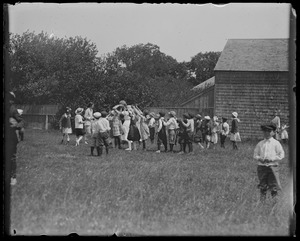 Group at Ag. Hall, WT. Children playing ball (Raymond's house in background)