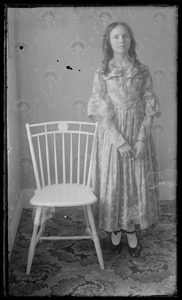 Interior. Young woman & chair