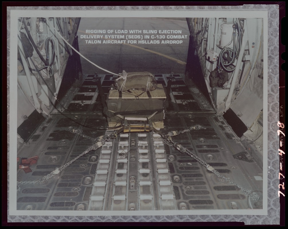 Rigging of load with sling ejection delivery system (SEDS) in C-130 combat Talon aircraft for HSLLADS airdrop