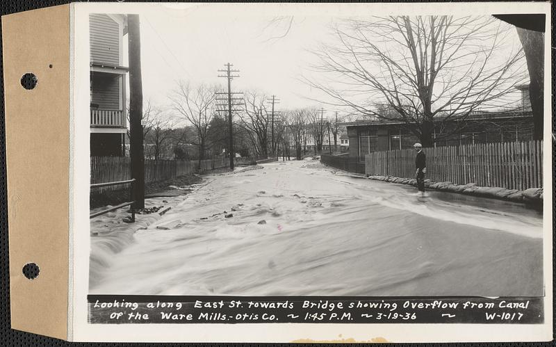 Looking along East Street towards bridge showing overflow from canal of the Ware Mills, Otis Co., Ware, Mass., 1:45 PM, Mar. 19, 1936