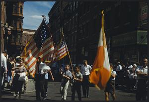 Children carrying flags in parade, Boston