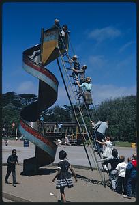Children climbing ladder of twisting slide, San Francisco Zoo