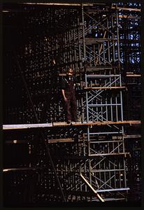 Worker standing on scaffolding