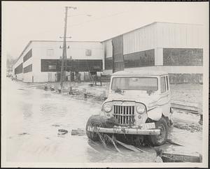 Flood water, jeep license 824-393, debris
