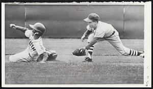 Texas Two-Bagger- Walter Kilgo of Waco, Tex., slides safely into second base with a double in yesterday's Little League World Series semifinal against Windsor Locks, Conn. The fielder is shortstop Howard Tersavich. Connecticut won, 1-0, and will meet Stoney Creek, Ont., tomorrow for the title. The Canadians topped Indiana by the same score.