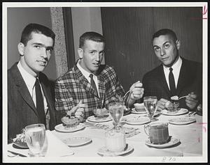 Only Repeaters from last year's Greater Boston Baseball League all-star team enjoy dinner. Left to right, pitchers Paul DelRossi of Harvard, and Dick McPherson of Northeastern, and Boston College captain, catcher Bob DeFelice. All-stars were feted last night at Commonwealth Motor Inn.