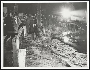 Night scene- Taunton. Grim faces express wait + see Morey Dam, on Bay St.