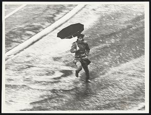 Inside-Out Umbrella and wet feet were plight of Dock Square pedestrian.