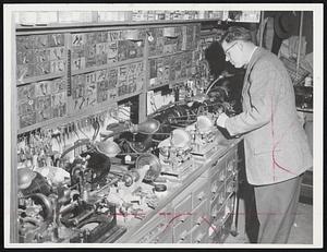Key Man in Many a lockout is Frank Pasek, shown here at one of his key machines, in which keys of all types are manufactured. Pasek has been a locksmith for 30 years, his father for 67 years. Stubborn locks have kept him working for hours, but so far he's never been stopped by one of them.