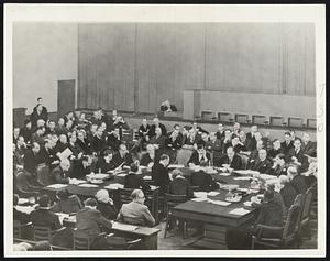 The League of Nations council in session Dec. 18 when it rejected the peace plan for Ethiopia drawn up by Samuel Hoare, British foreign secretary who resigned the same day, and Premier Laval of France. Hoare's successor, Anthony Eden, who opposed the plan, is at right-center, with hand at chin. Laval is the third figure to Eden's right.