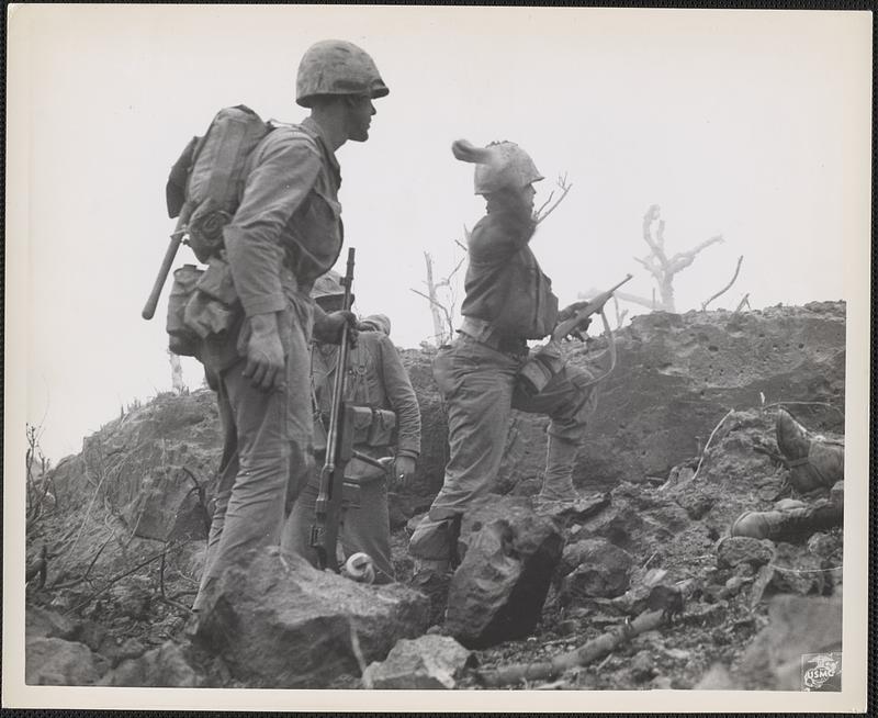 Marines, cornering a group of [Japanese] in a cave on the northern part ...