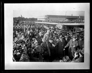 Clarence Chamberlin in the center of a crowd of people