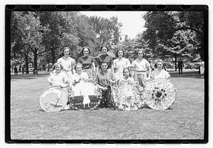 Group holding circular emblems