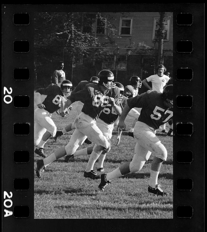 Harvard football players work out at team practice, Brighton