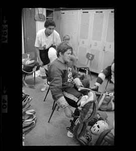 Youth hockey players in locker room, Woburn