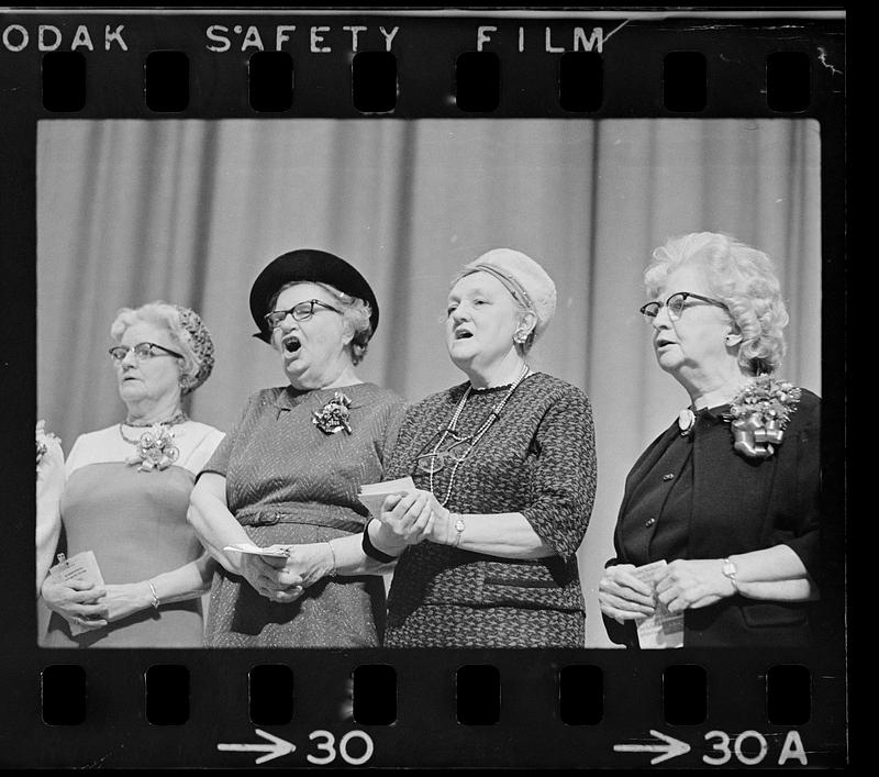 Elderly women sing at concert, Hynes Auditorium