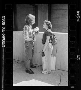 Couple meets with flowers, Boston