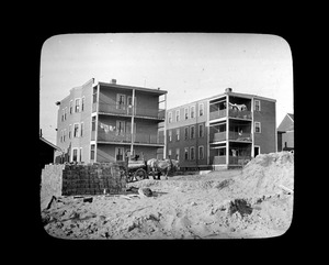 Two-three apartment houses, built from materials obtained from Old Quincy School