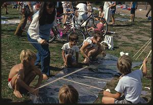 Children assembling kites