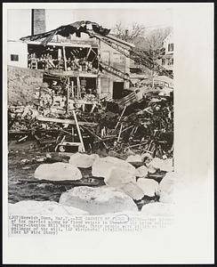 Ice Carried by Flood Waters--Huge blocks of ice carried along by flood waters in Norwich lie below collapse Turner-Stanton Mill here today. Three people were killed in the collapse of the mill.