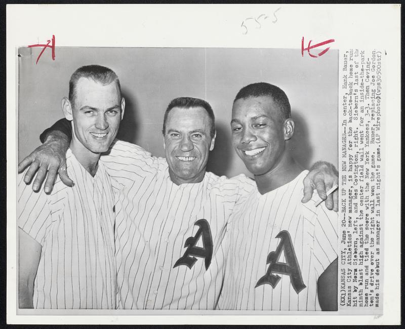 Back Up the New Manager--In center, Hank Bauer, Kansas City Athletics’ new manager, is happy for the back-to-back home runs hit by Norm Siebern, left, and Wes Covington, right. Siebern’s last of the ninth blast high against the center field wall went for an inside-the-park home run and tied the score with the New York Yankees, 3-3. Then Covington’s drive over the right wall won the game. Bauer, replacing Joe Gordon made his debut as manager in last night’s game.