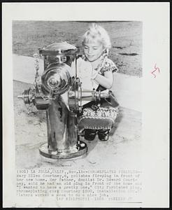 Chromeplated Fireplug--Mary Ellen Courtney,6, polishes fireplug in front of her new home. Her father, dentist Dr. Edward Courtney, said he had an old plug in front of the home and “I wanted to have a pretty one.” City furnished plug, chromeplating cost Courtney $200, installation $22.50. Platers worked a week to do a nice job.