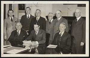 Boston Committee on National Air Mail. Seated, left to right -- Postmaster Peter F. Tague, Mayor Tobin and George H. Doggett, committee chairman. Standing-Charles A. Coyle, publicity; M. D. Liming, vice-chairman; Ernest Dudley Chase, business and professional; Bernard J. Shaughness, civic and fraternal activities.