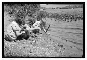 Children by a body of water