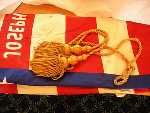 Detail of flag with gold tassels