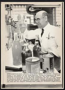 Food Chain Checks Cyclamates- Howard A. Rogers a lab chemist at the First National Stores in Somerville at work checking cyclamates in food and drink products. The First National Stores is co-operating fully with the government and has put into effect an immediate study if all items which might contain cyclamates. The food chain has called all companies which process cyclamate-bearing products for them and has stopped ordering such items.