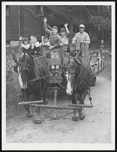 Old-Time Hayride around the 175-acre Drumlin Farm was big thrill for these youngsters at Massachusetts Audubon Society's fall farm festival.