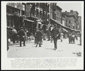 Historic Photo – This photograph of Hester Street on New York’s City’s Lower East Side in the 1890 reflects the lives of Jewish immigrants in the late 19th and early 20th Century. It served as a marketplace for Jewish peddlers and was the only playgrounds for Jewish children (at right). Photo was taken by Jacob A. Riis, a Jewish immigrant whose startling pictures of the Lower East Side ghetto areas led to some reforms. Entitled “The Street – The School Children’s Only Playground,” it is part of the Jacob A. Riis collection in the Museum of the City of New York.