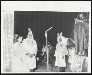 Klan Wedding--James Earl Taylor and Bessie Irene Taylor were married in a dusty North Carolina cornfield Saturday night in the first Ku Klux Klan wedding in 39 years. He is an automobile body shop operator in Farmville. She wore a light blue full length old southern style party dress.