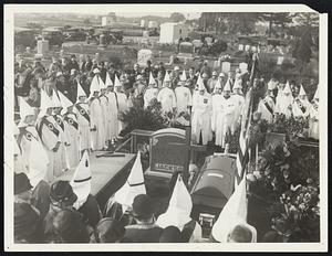 Women Ku Klux Klaners Hold Funeral Servicers for Departed Members. Hempstead, L.I. Women K.K.K.’s of Queens and Nassau counties presided over the burial services for Mrs. Armenia Jackson, of Lynbrook, L.I. The services and interment took place in the Greenfield Cemetary Hempstead. Photo Shows- the scene at the gravd.