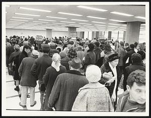 Long Lines of persons awaiting unemployment checks at Bowdoin St. office.