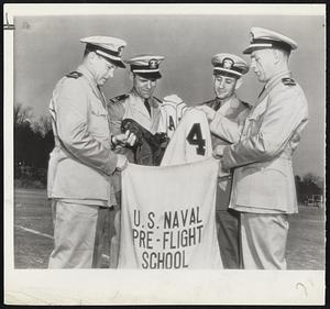 [Pa]ck Up Your Troubles-These former big leaguers wouldn't exactly call their baseball [gea]r troubles, they are packing them up for the duration as they report for duty at Chapel Hill [Na]vy Pre-Flight School. Left to right-Lt. (jg). Buddy Hassett, Lt. (jg) Pete Appleton, Lt. [illegible] Charley Gehringer and Lt. (jg) Hal Schumacher.