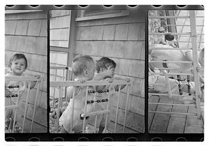 Two children in a playpen