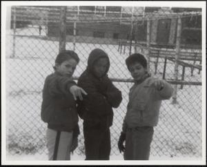 Three boys posing for the camera