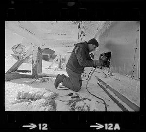 Technicians working at Mount Washington weather station in winter, New Hampshire