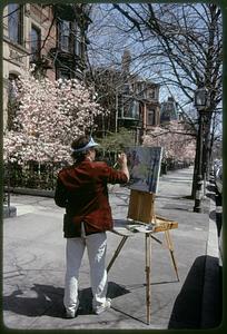 Artist paints springtime magnolias on Newbury Street, Back Bay, Boston