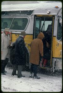 Boarding bus in winter, Central Square, Cambridge