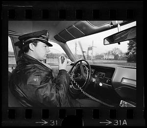 State Trooper Sparda on radio at barracks, Framingham