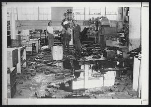 Outside the Wyman-Gordon Co. plant in Worcester, 92 inches of water, seen in above photo, made an early resumption of operations seem impossible. Yet, one week later, the plant was against turning out jet compressor wheels as seen in these pictures.