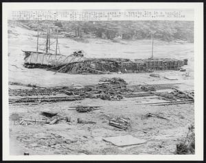 Railroad cars and tracks lie in a tangled mass after waters of the Eel River receded near Scotia, Calif., some 25 miles south of here 12/26.