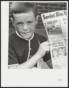 Freckle King John O'Grady, 12, of Everett is flanked by judges Sam Hoffman and Miss Ellen Barbour at 31st annual Freckle Contest Contest held by Boys' Clubs of Boston. Left, Paul Healey, 7, of Charlestown checks out Traveler story on freckles. Paul was awarded a prize for being the smallest boy with largest freckles.